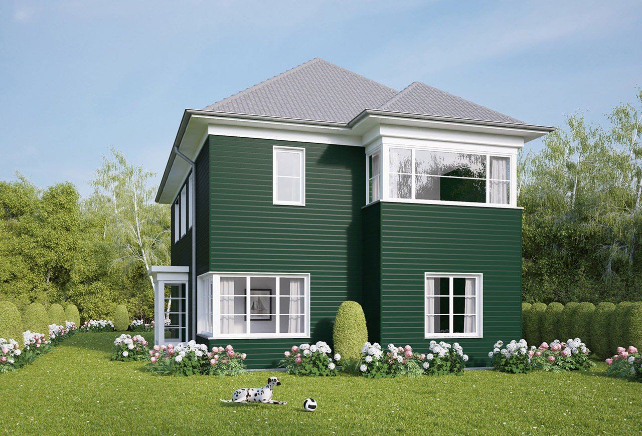 Ein Landhaus mit grünen Fassadenpaneelen VinyPlus Stülpprofil in der Farbe dunkelgrün.